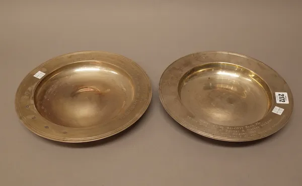 Two silver circular dishes, each presentation inscribed, modern dates, both 25.5cm diameter, combined weight 1310 gms, (2).