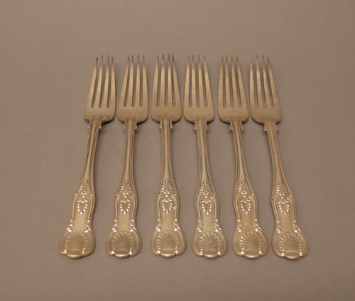 Six Victorian silver double struck King's pattern table forks, each crest engraved, comprising; one London 1858, five London 1859, combined weight 595