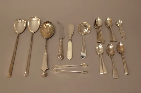 Silver flatware, comprising; a pair of salad servers, Birmingham 1909, one salad serving spoon, Sheffield 1892, a sugar sifting spoon, London probably