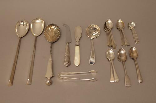 Silver flatware, comprising; a pair of salad servers, Birmingham 1909, one salad serving spoon, Sheffield 1892, a sugar sifting spoon, London probably