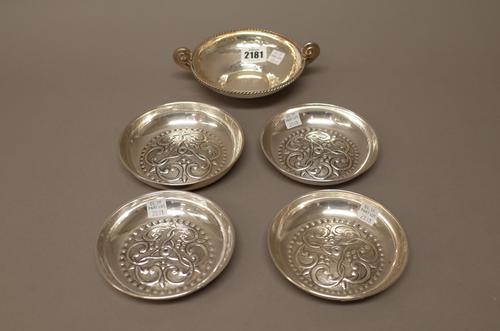 Foreign wares, comprising; a Greek twin handled circular bowl, having a cable border and four circular dishes, with similarly scroll embossed decorati