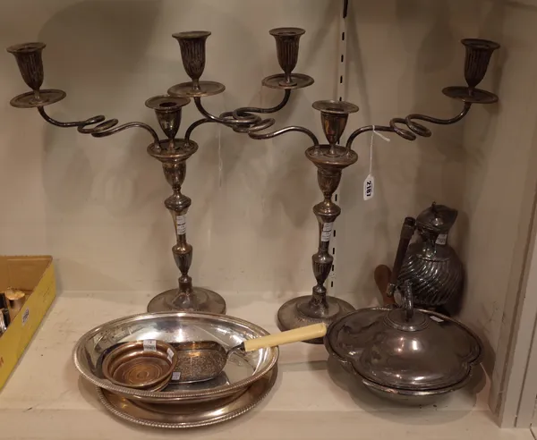 A group of plated wares, comprising; a pair of three light table candelabra (four sconces lacking), a circular dish, a lidded three division dish, fit