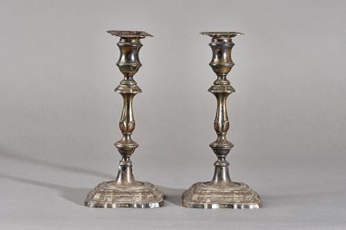 A pair of silver table candlesticks, each having a knopped stem and raised on a shaped square base, in the 18th century taste, (loaded), Sheffield 191