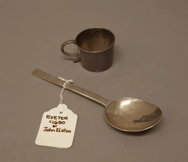 A slip top style spoon, possibly Exeter late 17th century, length 16.5cm and a small mug, having a scrolling handle, engraved with initials I*S and S