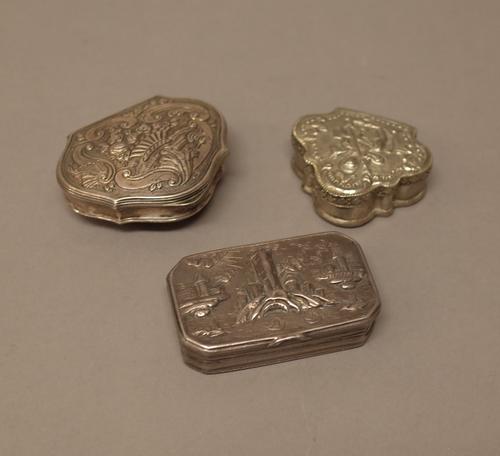 Foreign and plated wares, comprising; a cartouche shaped snuff box, the cover decorated with fruit within borders of scrolls, a cut cornered rectangul