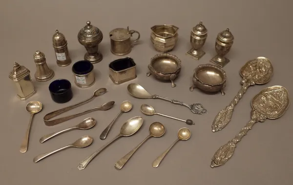 Silver, comprising; six pepperettes, five salts, a mustard pot, a pair of Victorian spoons, decorated with figures, London 1892, six condiment spoons