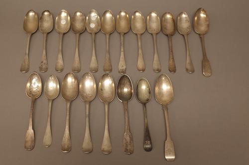 A silver fiddle pattern tablespoon, London 1827, eighteen foreign spoons and one plated spoon, (20). 1895