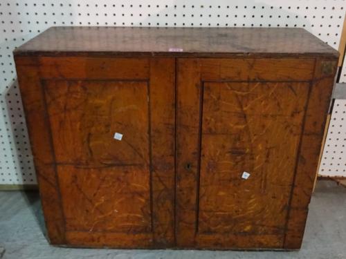An early 20th century oak two door cabinet, 74cm wide x 60cm high.   M5  1208