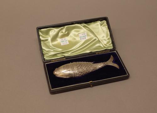 A European vinaigrette formed as an articulated fish, the head with red gem set eyes fitted with a hinged compartment and a second hinge opening to re