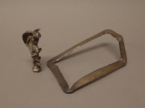 A European plated desk seal, modelled as an angel brandishing a sword above a dragon, the circular base uncut, probably second half of the 19th centur