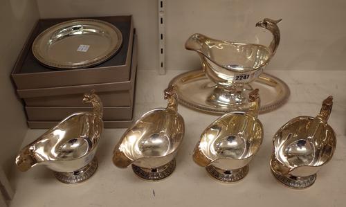 A group of Christofle plated wares, comprising; a large sauce boat with integral stand, 23.5cm, four smaller sauce boats, each with a birds head motif