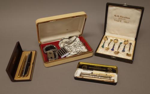 A set of six Scandanavian silver gilt and vary coloured enamelled teaspoons having fan shaped terminals to the handles, detailed 925 S G.R, with a cas