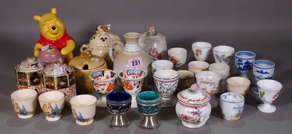 Ceramics, including; a large group of mainly 20th century egg cups and honey pots, (qty).  S3T