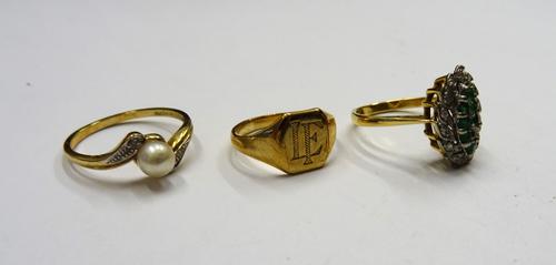 A gold and platinum, emerald and diamond set marquise shaped cluster ring (one emerald lacking), a 9ct gold ring, mounted with a single cultured pearl