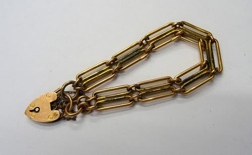 A 9ct gold bar and oval link gate bracelet, in a two row design as converted from a watch Albert chain, fitted with a heart shaped padlock clasp, deta