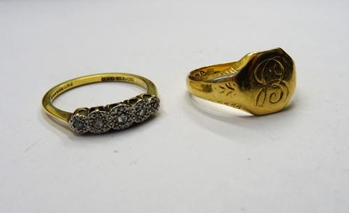 A gold and platinum, diamond set five stone ring, mounted with a row of circular cut diamonds graduating in size to the centre stone, detailed 18 CT P