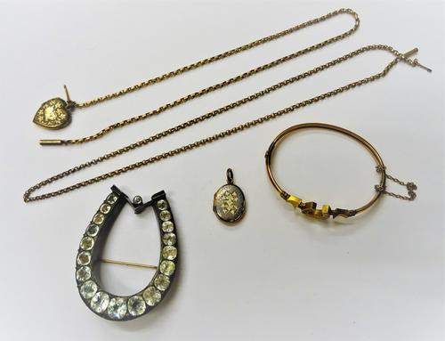 A late Victorian gold, rose diamond and red gem set oval hinged bangle, with a horseshoe motif, detailed 9 CT, a gold neckchain, detailed 9 C with a c