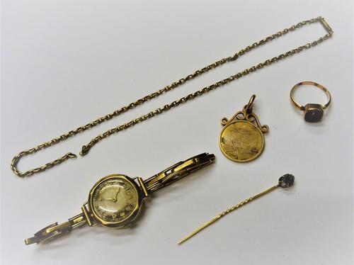 A 9ct gold circular cased lady's wristwatch, Birmingham 1933 on a sprung bar link 9ct gold bracelet, a gold pendant, engraved with a figure about to d
