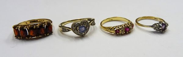 A gold, diamond and red gem set ring, mounted with two pairs of rose diamonds alternating with three red gems, a 9ct gold and garnet set five stone ri