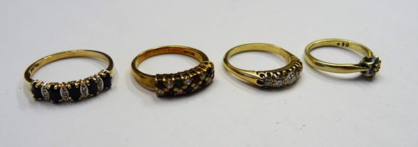 A gold and diamond set five stone ring, mounted with a row of cushion shaped diamonds graduating in size to the centre stone, a gold, diamond, ruby, s