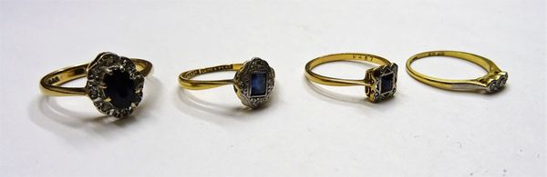 A gold and platinum, sapphire and diamond cluster ring, mounted with the rectangular cut sapphire in a surround of four circular cut diamonds, detaile