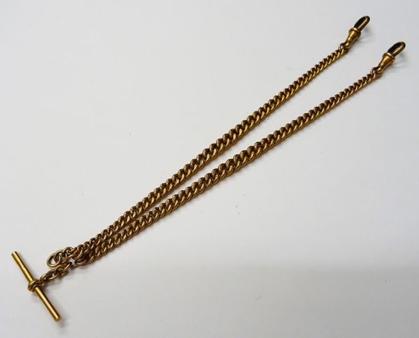 A 9ct gold graduated curb link watch Albert chain, fitted with two 9ct gold swivels and with a 9ct gold T bar, weight 32.1 gms.