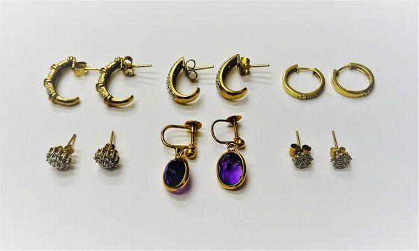 A pair of gold and diamond set earrings, in a curved design, the backs with post and butterfly clip fittings, a pair of gold mounted amethyst single s