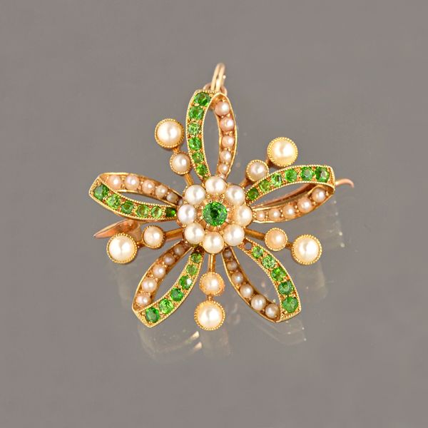 A gold, demantoid garnet and seed pearl set pendant brooch, in a curved cinquefoil design, with a cluster at the centre, detailed 15 CT, gross weight