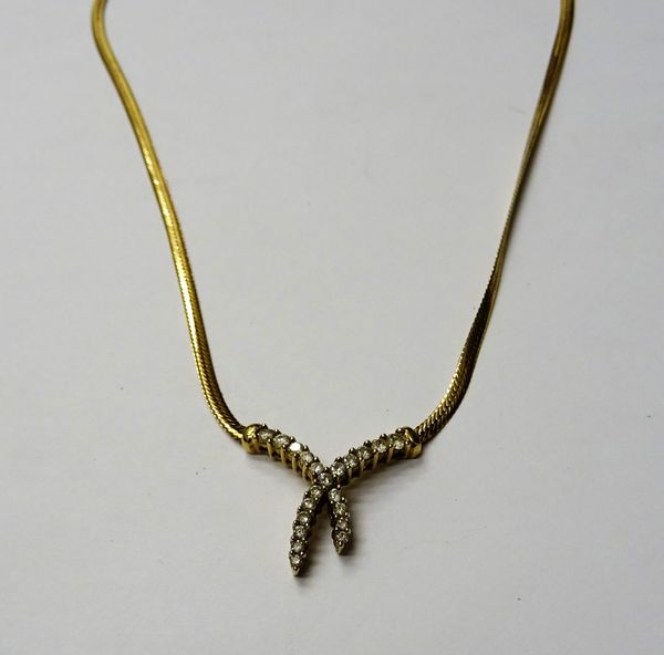 A 9ct gold and diamond set necklace, the front claw set with two rows of graduated circular cut diamonds, in a twistover design, on a flat link neckla