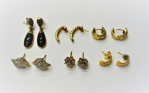 A pair of 9ct gold and diamond earstuds, each in a pierced twist design, the backs with post and butterfly clip fittings, a pair of 9ct gold and diamo