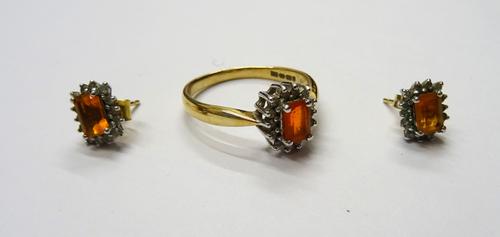 A 9ct gold ring, claw set with a rectangular step cut fire opal to the centre, in a surround of circular cut diamonds, ring size T and a pair of gold