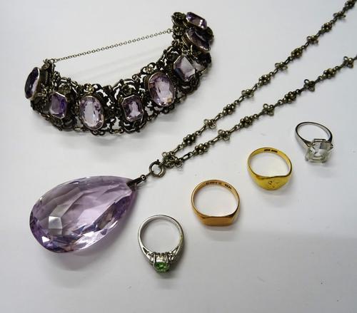 A gold signet ring, crest engraved, detailed 18 CT, weight 5.5 gms, a 9ct gold signet ring, weight 3.6 gms, an amethyst set panel link bracelet on a s