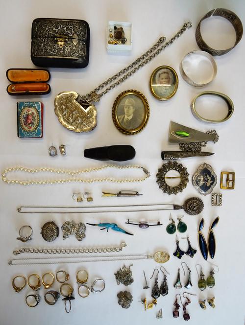 An oval photographic portrait miniature of a lady, displayed in a filigree fronted case, three bangles, five brooches and pins, a filigree pendant wit