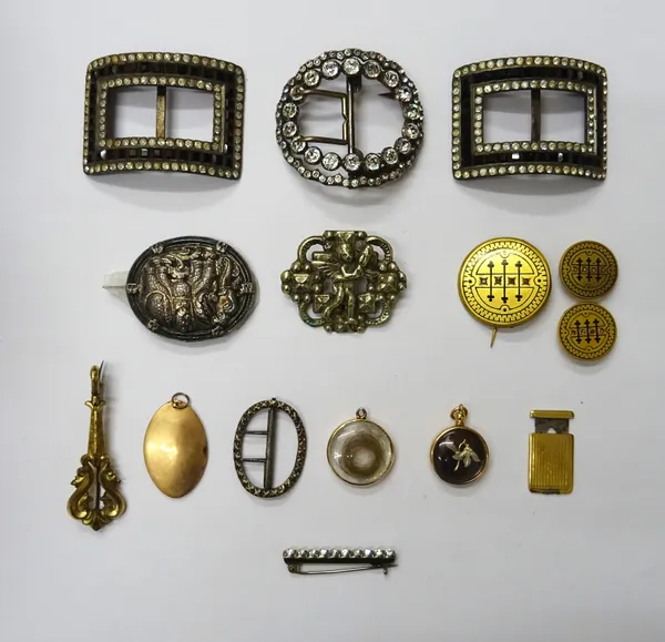 A group of mostly jewellery, comprising; a pair of paste set curved rectangular buckles, a colourless paste set oval buckle, a smaller silver oval buc