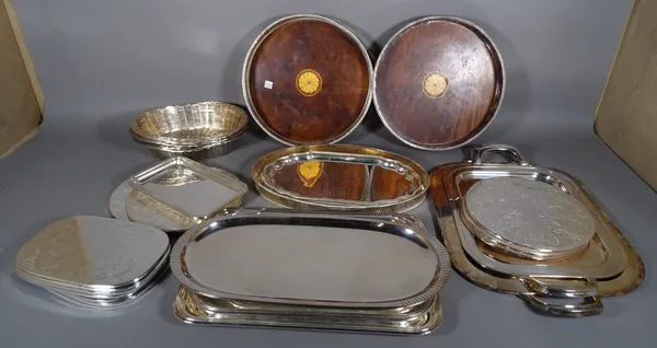 A quantity of 20th century silver plated trays and place mats, (qty).  S2B