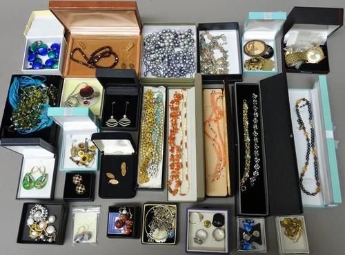 A collection of mostly costume jewellery, including; a single row necklace of garnet beads, a few silver pieces, also necklaces, bracelets, rings, a p