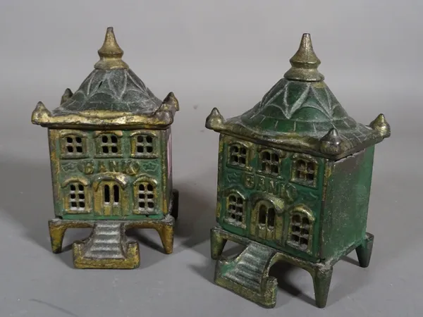 A pair of early 20th century cast iron money boxes, formed as buildings of banks, 8cm x 14cm, (2)  CAB