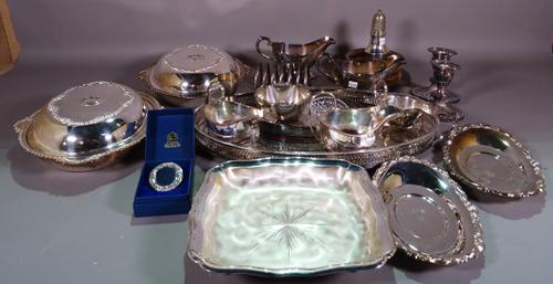 A group of plated wares, including a twin handled oval tray, a pair of shaped oval lidded entree dishes, two pairs of sauceboats, a shaped square dish