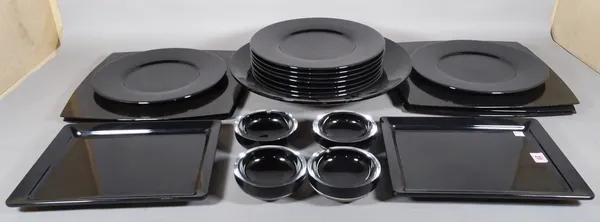 A quantity of 20th century black lacquer plates and bowls and four black glass ashtrays, (qty).  S2T