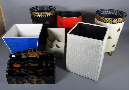 Office items, comprising; a group of five waste paper bins, the largest 25cm wide x 35cm high and two stationary racks, (7).   BAY 2
