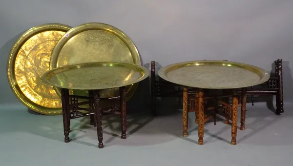 A group of four 20th century brass tray top tables, 78cm wide x 48cm high, (4).   H7