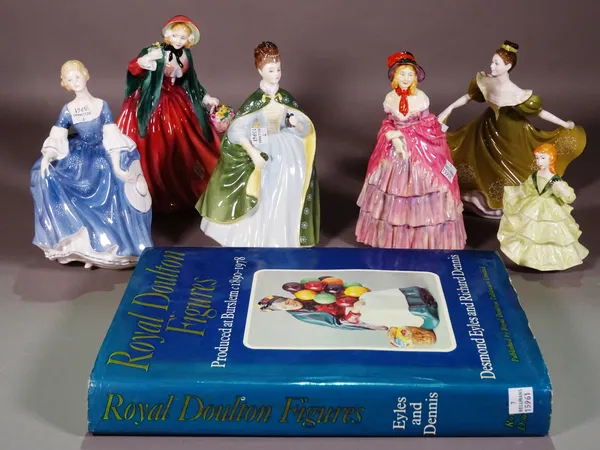 A group of six Royal Doulton figures and an associated book, (7).  S3M