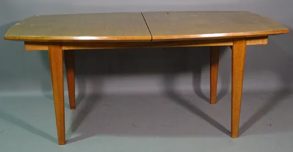Gordon Russell;  a 20th century teak rectangular extending dining table, on tapering supports, 180cm long x 75cm high x 235cm fully extended.  H9