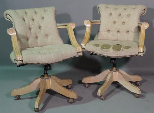 A pair of 20th century limed oak office open armchairs. (a.f.) (2).  BAY 2