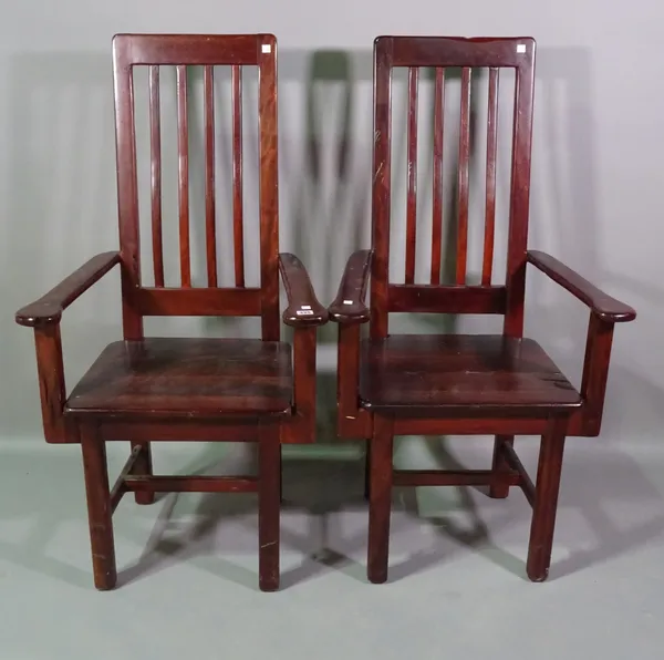 A pair of 20th century hardwood open armchairs, (2).   E7