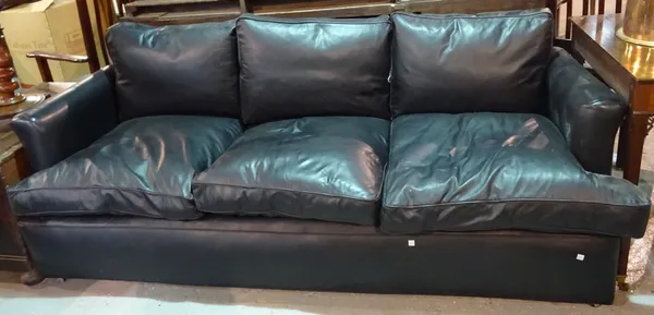 A 20th century hardwood framed three seater low sofa with black leather studded upholstery, 202cm wide.  D7