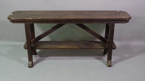 An 18th century and later oak bench on stylised hoof feet, 140cm wide x 61cm high.  BAY 1