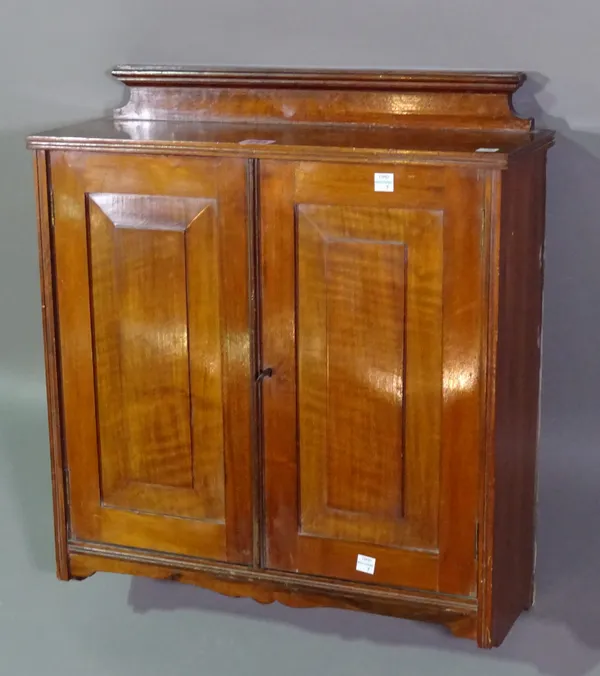 A small late 19th century walnut two door hanging cupboard, 50cm wide x 56cm high.  A3