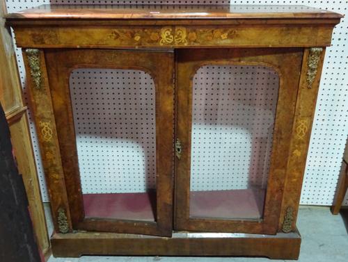 A Victorian marquetry inlaid figured walnut pier cabinet with a pair of glazed doors on plinth base, 112cm wide x 107cm high x 33cm deep    H10