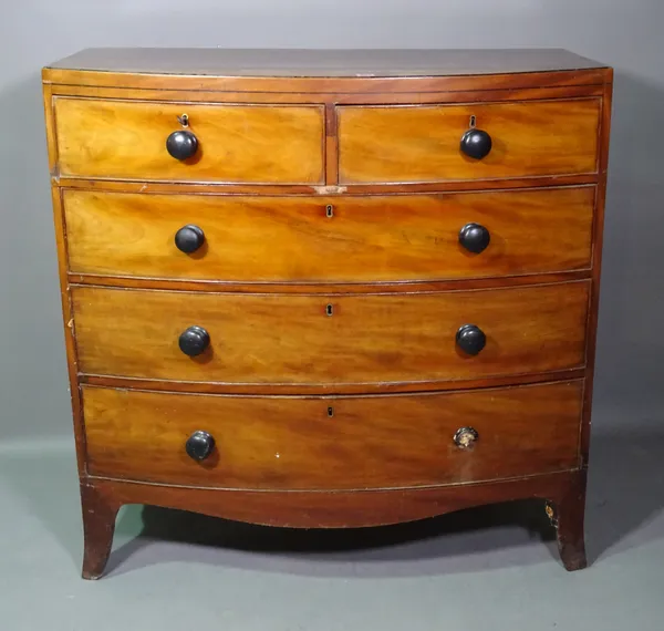 A George III mahogany and ebony strung bowfront chest of two short and three long graduated drawers on splayed bracket feet, 105cm wide x 106cm high.